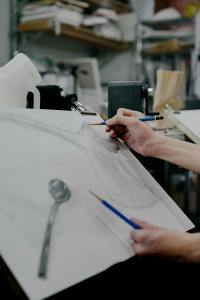 Art student drawing a still life setup in a Shinjuku studio, Tokyo, Japan.