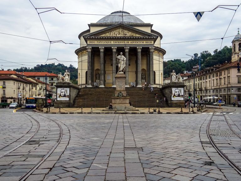 View of Gran Madre di Dio Church in Turin, Italy, showcasing its neoclassical architecture and public square.